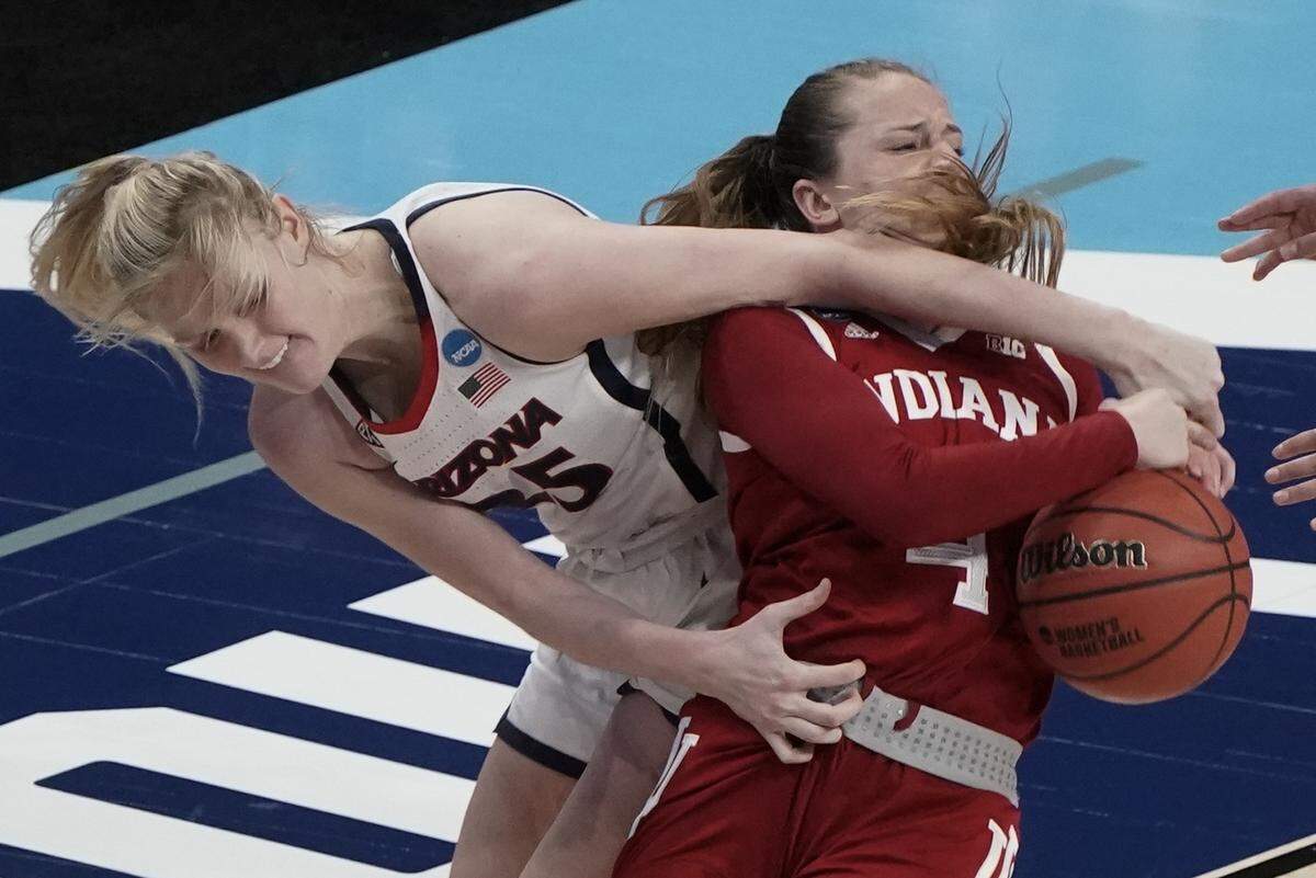 Arizona’s Cate Reese and Indiana’s Nicole Cardano-Hillary battle for a rebound during the second half of an NCAA college basketball game in the Elite Eight round of the Women’s NCAA tournament Monday, March 29, 2021, at the Alamodome in San Antonio. 
