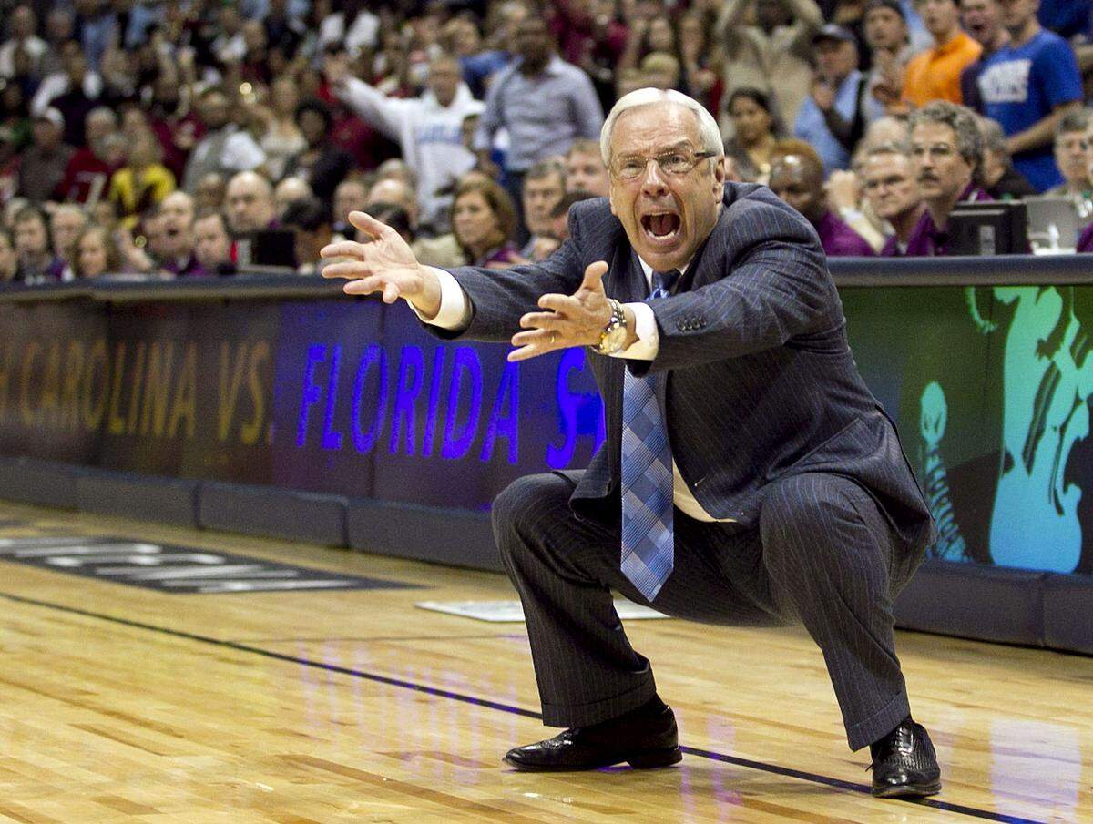 UNC coach Roy Williams wants a foul called against Florida State's Bernard James (5) after he blocked a shot by UNC's P.J. Hairston (15) with 0:41 seconds to play in the championship game of the ACC Tournament on Sunday March 11, 2012 at Philips Arena in Atlanta, Georgia.
