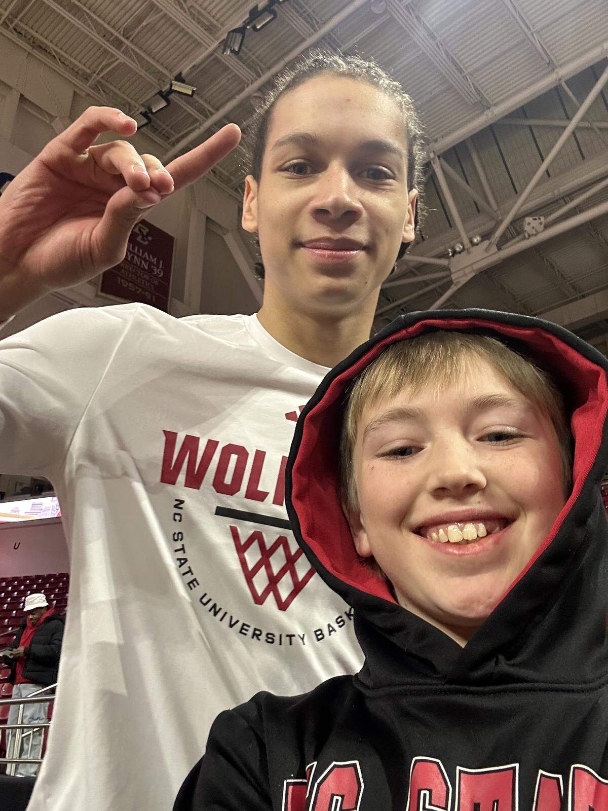 N.C. State’s Matt Able takes a selfie with Finley Hall ahead of the Wolfpack’s men’s basketball game at Boston College on Jan. 6, 2026, in Chestnut Hill, Mass.