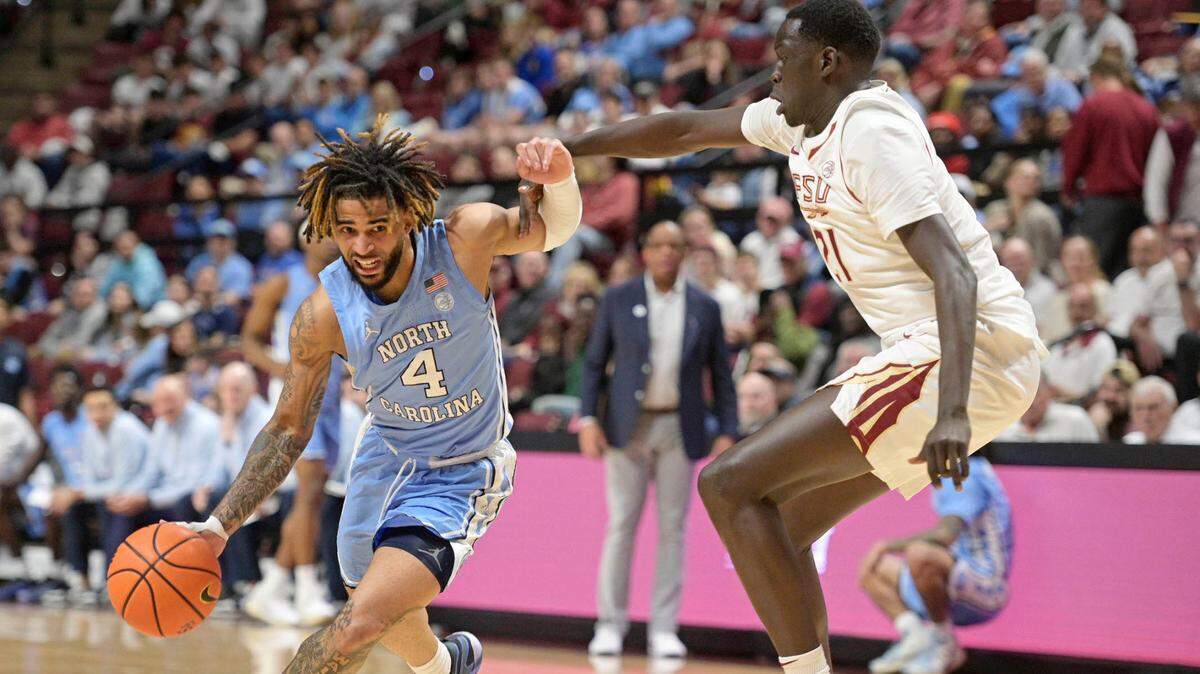 Feb 24, 2025; Tallahassee, Florida, USA; Florida State Seminoles forward Alier Maluk (21) defends North Carolina Tar Heels guard RJ Davis (4) during the first half at Donald L. Tucker Center.