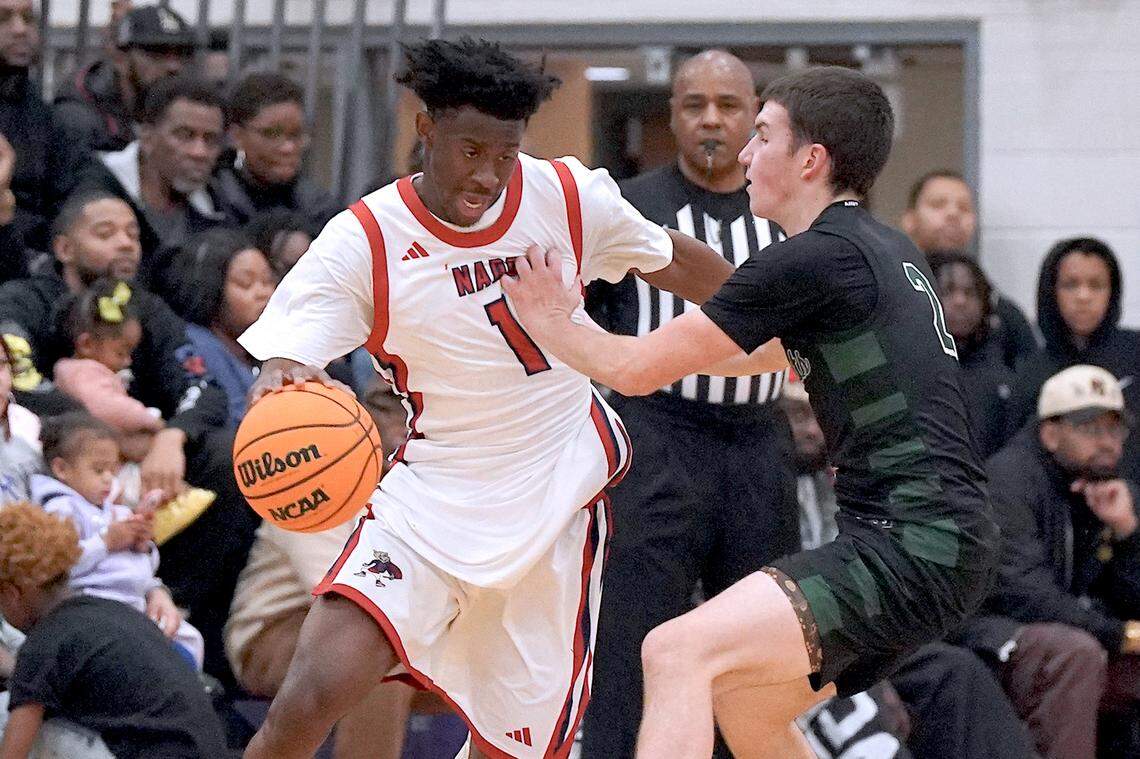 Greenfield's Johnny Winborne (2) defends Coronado's Munir Greig (1) during the first half. The Greenfield Knights and the Coronado Cougars (Nevada) met in the finals of the Day'Ron Sharpe bracket of the  John Wall Holiday Tournament in Raleigh, N.C. on December 30, 2025.