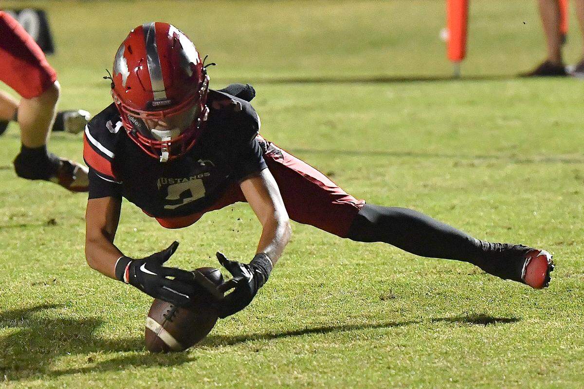 Middle Creek cornerback Jacob Salazar (3) dives to recover the fumble from Apex Friendship during the first half. The Middle Creek Mustangs and the Apex Friendship Patriots met in a football game in Cary, N.C. on October 25, 2024.