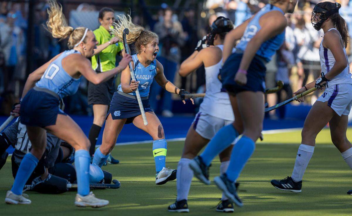 North Carolina’s Katie Dixon reacts after teammate Charly Bruner (2) scored to take a 1-0 lead over Northwestern during the NCAA Division I Field Hockey Championship game on Sunday, November 19, 2023 at Karen Shelton Stadium in Chapel Hill, N.C.