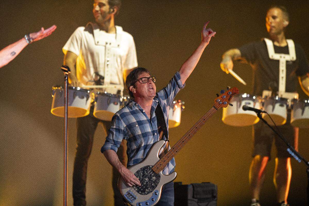 Matchbox 20 bassist Brian Yale salutes the crowd at Raleigh, N.C.’s Coastal Credit Union Music Park at Walnut Creek, Wednesday night, July 12, 2023.