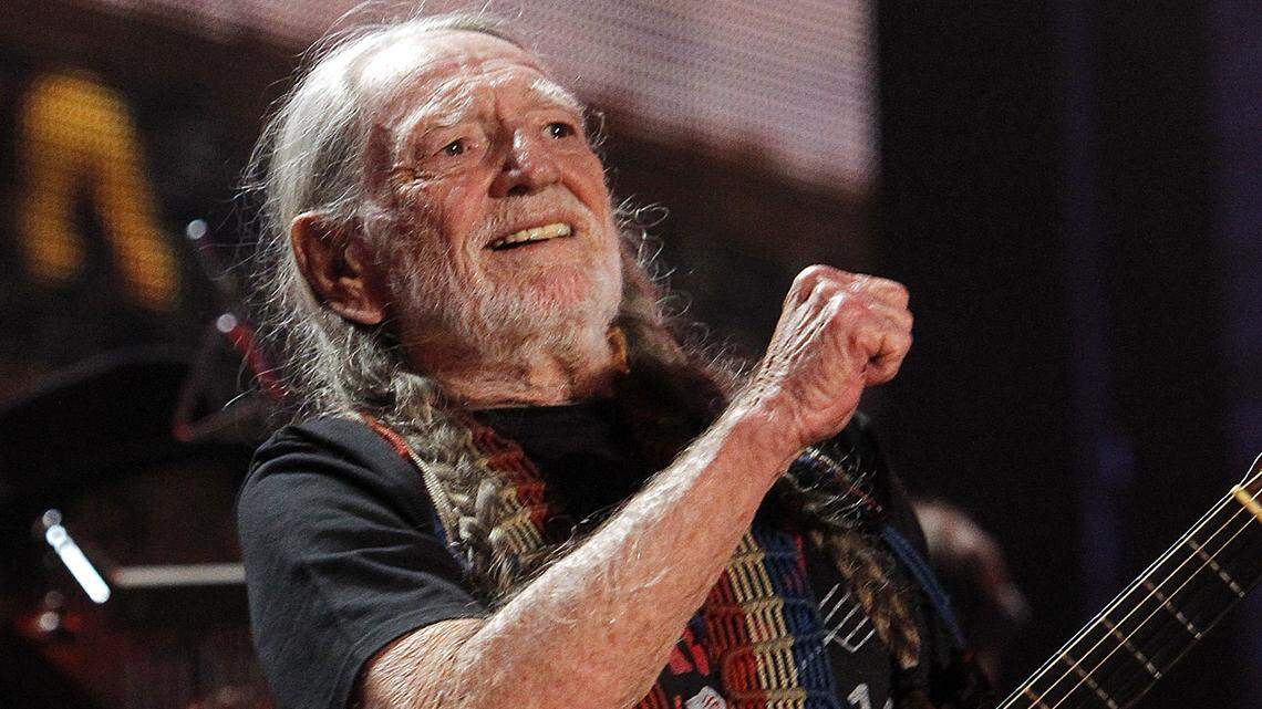 Willie Nelson plays at the Farm Aid concert held at Walnut Creek Amphitheatre in Raleigh on Sept. 13, 2014.
