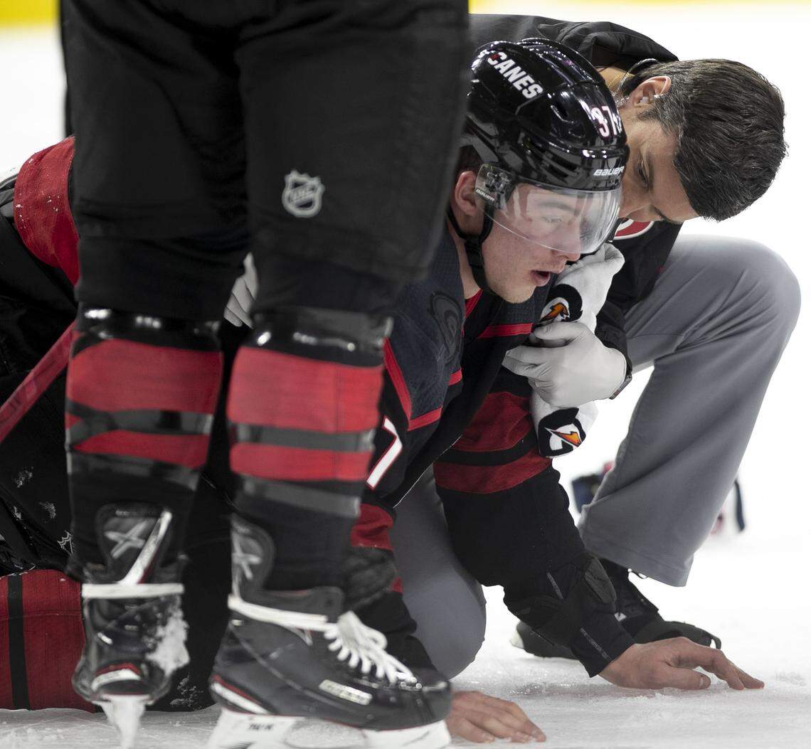 Carolina Hurricanes’ Andrei Svechnikov (37) is attended to after being knocked to the ice during a fight with Washington’s Alex Ovechkin during the first period on Monday, April 15, 2019 at the PNC Arena on Raleigh, N.C.