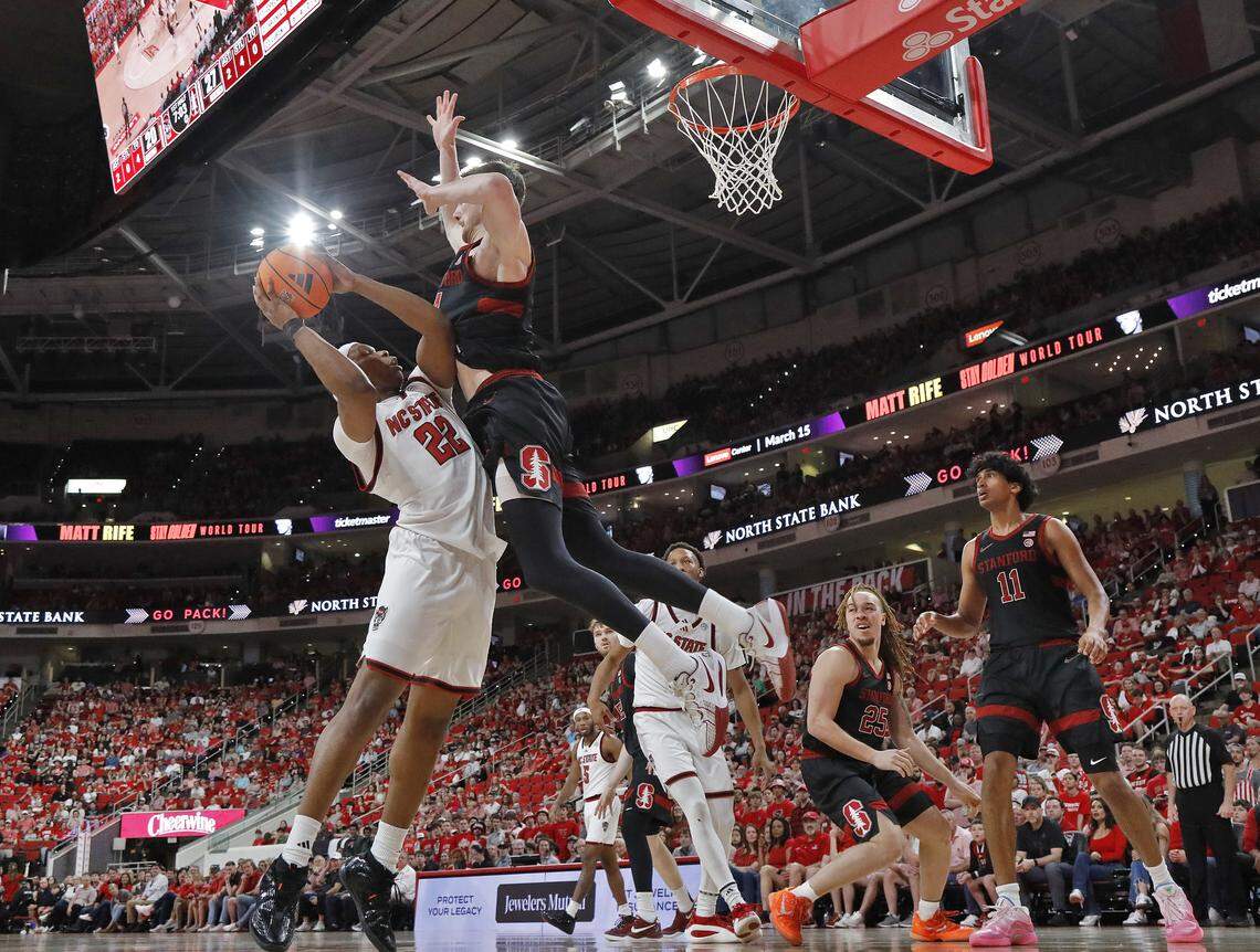 N.C. State's Ven-Allen Lubin shoots over Stanford's AJ Rohosy during the first half of the Wolfpack’s 85-84 loss on Saturday, March 7, 2026, at Lenovo Center in Raleigh, N.C.