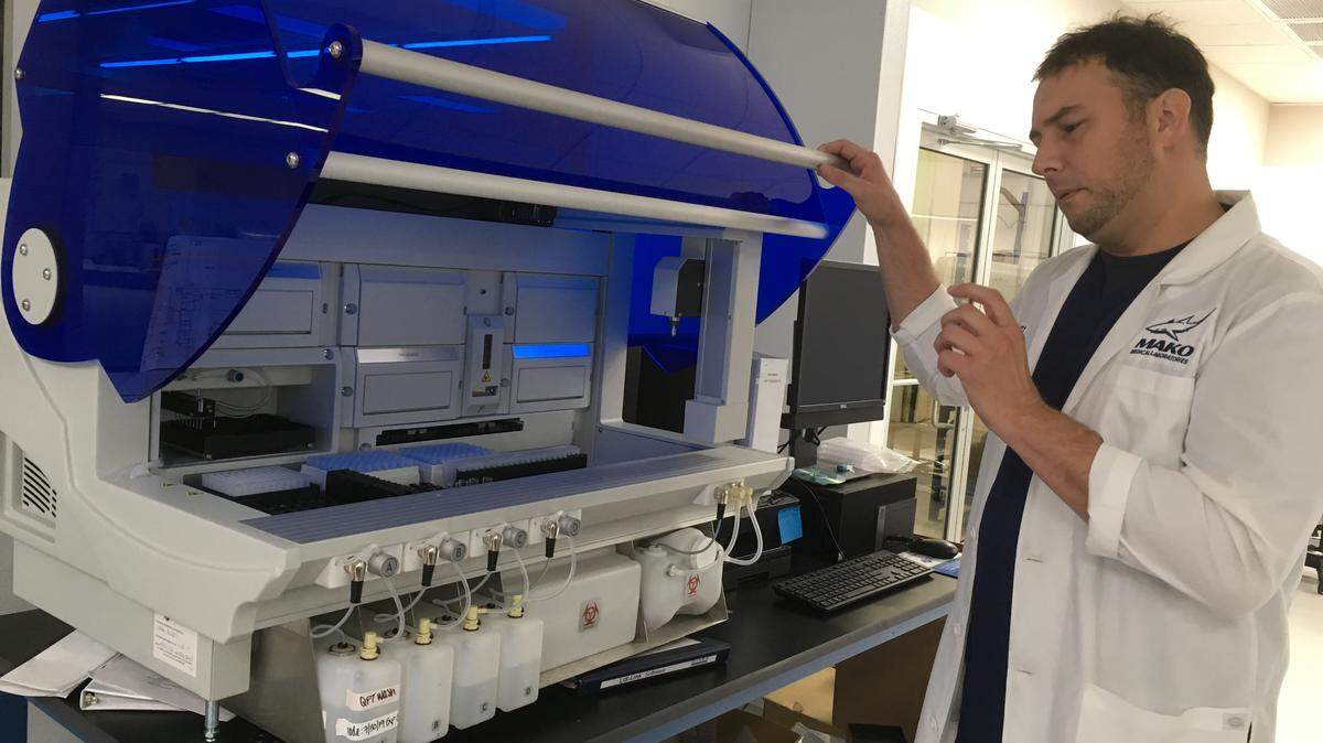 Mako Medical CEO Chad Price with one of the diagnostic machines at the company’s Henderson facility.