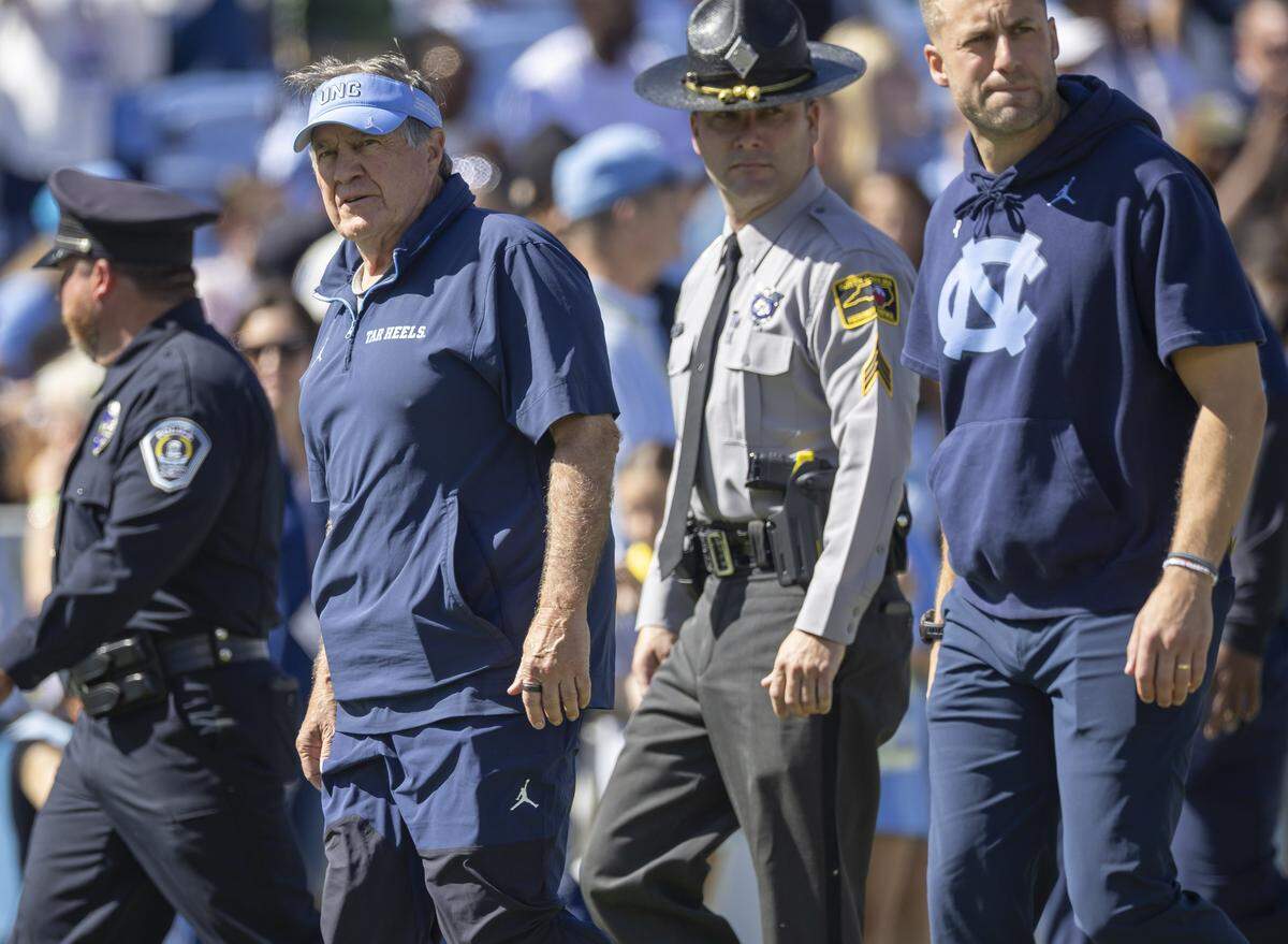 North Carolina coach Bill Belichick enters the field for the Tar Heels’ game against Clemson on Saturday, October 4, 2025 at Kenan Stadium in Chapel Hill, N.C. 