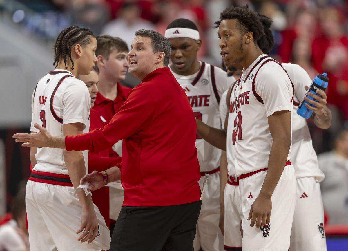 N.C. State coach Will Wade turns to argue with an official as he huddles with his players in the first half against North Carolina on Tuesday, February 17, 2026 at Lenovo Center in Raleigh, N.C.