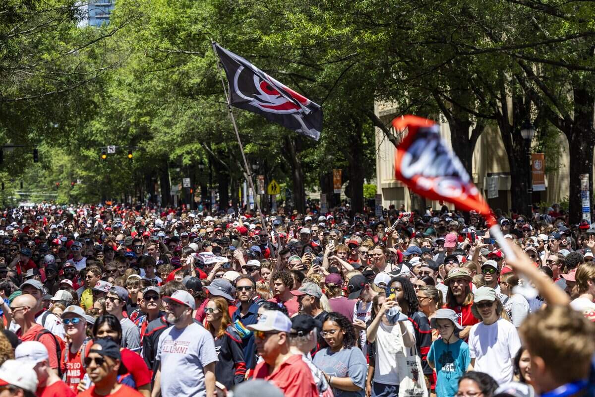 Thousands of Carolina Hurricanes fans gather in downtown Raleigh on Saturday, June 20, 2026, during a parade and rally celebrating the Hurricanes' Stanley Cup Final victory over the Vegas Golden Knights. The Hurricanes won the series 4-2 to capture the Stanley Cup for the second time since 2006.