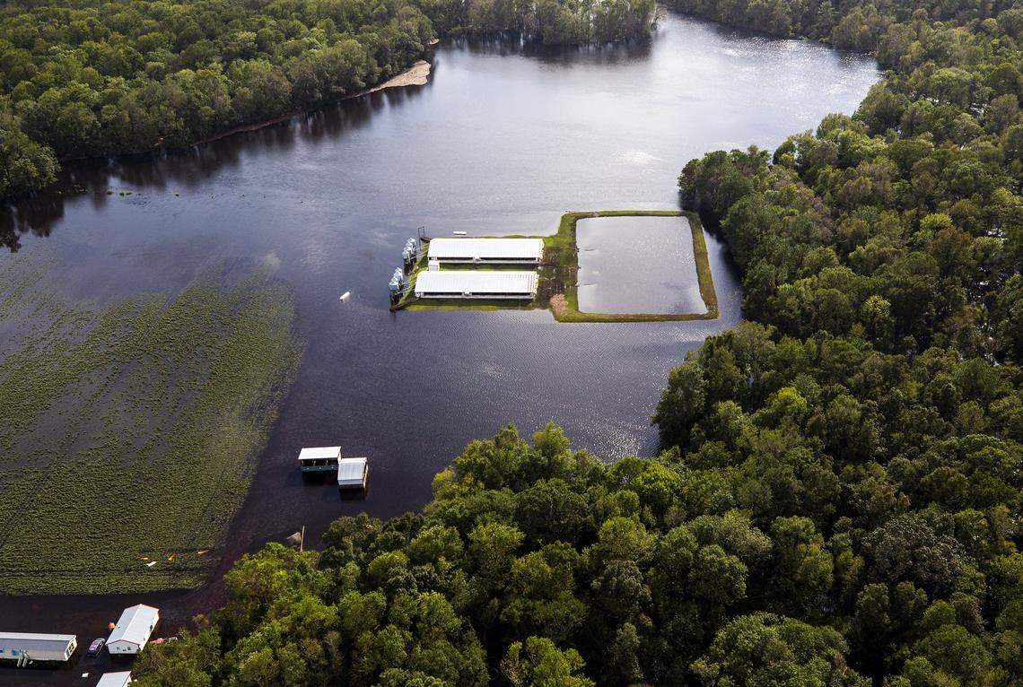 Three days after Hurricane Florence made landfall in Wilmington, NC, flood water still surrounds two hog houses and it’s lagoon near Kinston, NC, on Monday, Sept. 17, 2018.