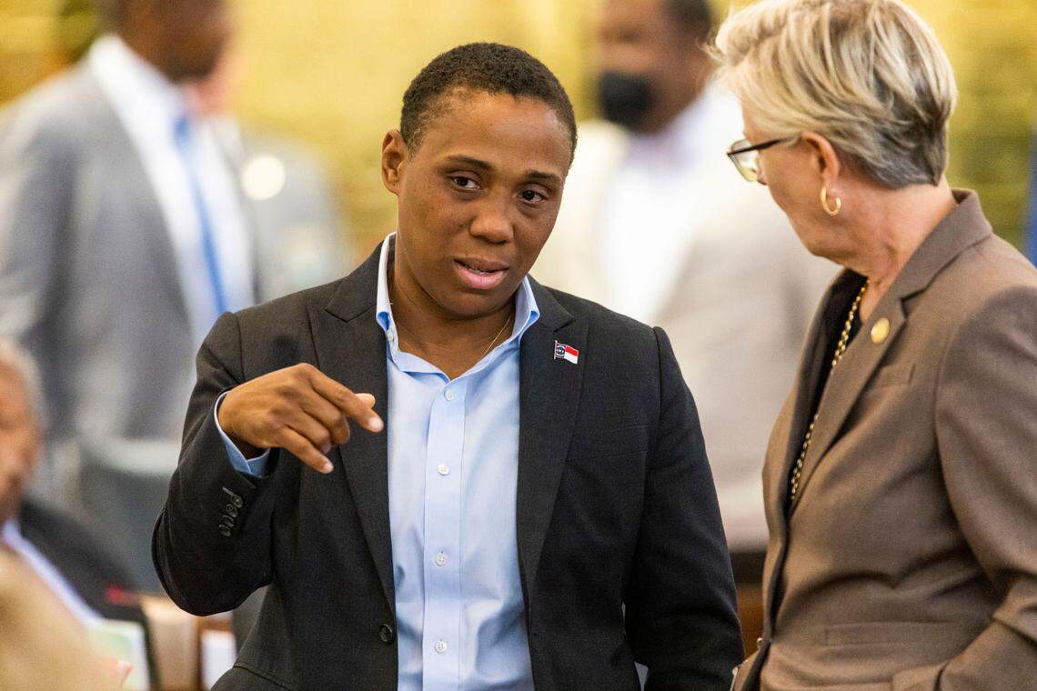 Rep. Vernetta Alston talks with Rep. Deb Butler during debate on sports betting on Wednesday, June 22, 2022 at the General Assembly in Raleigh, N.C.