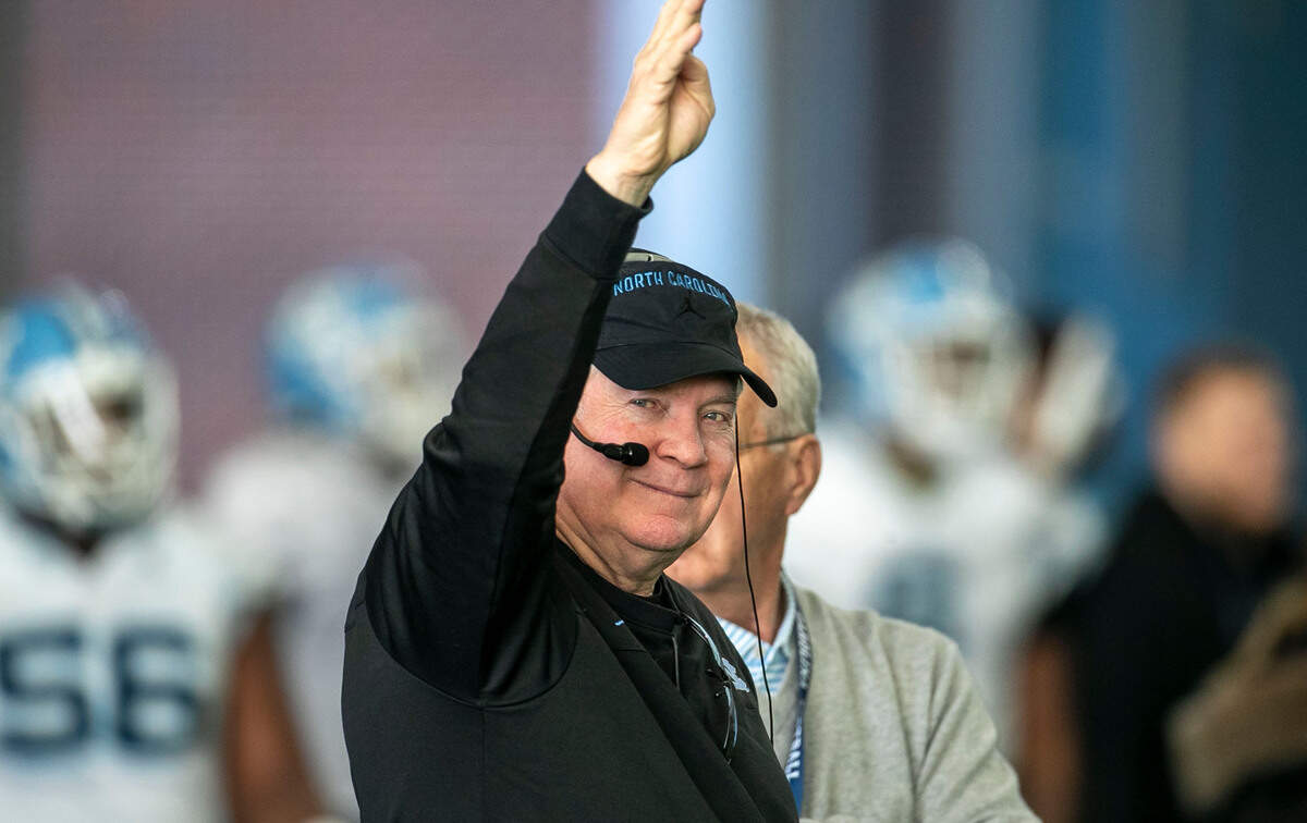 North Carolina coach Mack Brown smiles as he signals for the fourth period of practice during the opening day of spring football on Tuesday, March 1, 2022 in Chapel Hill, N.C.