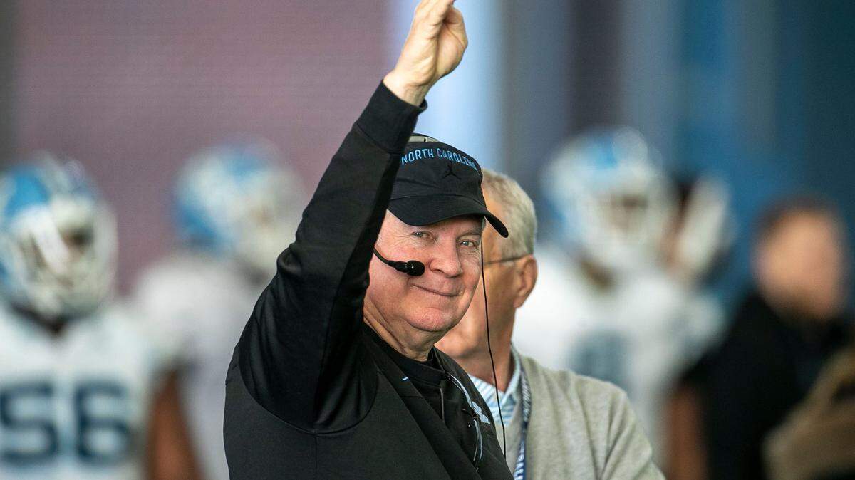 North Carolina coach Mack Brown smiles as he signals for the fourth period of practice during the opening day of spring football on Tuesday, March 1, 2022 in Chapel Hill, N.C.