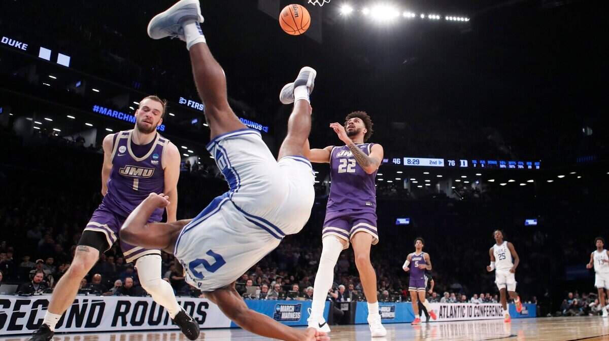 Duke’s Jaylen Blakes (2) goes down hard after being fouled by James Madison’s Noah Freidel (1) in the second half of Duke’s 93-55 victory over James Madison in the second round of the NCAA Tournament at the Barclays Center in Brooklyn, N.Y., Sunday, March 24, 2024.