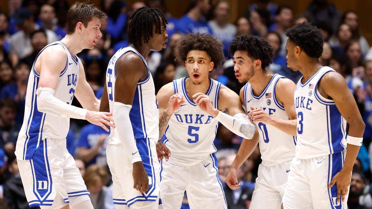 Duke’s Tyrese Proctor (5), center, huddles with, from left, Kyle Filipowski (30), Mark Mitchell (25), Jared McCain (0) and Jeremy Roach (3) during the first half of Duke’s game against Wake Forest at Cameron Indoor Stadium in Durham, N.C., Monday, Feb. 12, 2024.
