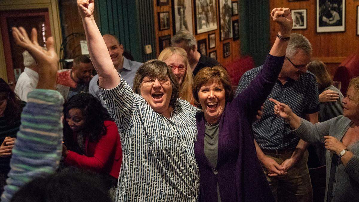 Wake commissioners District 7 seat challenger Vickie Adamson, left, and District 4 seat challenger Susan Evans celebrate primary election victories during an election watch party at Sawmill Tap Room in Raleigh on Tuesday, May 8, 2018.