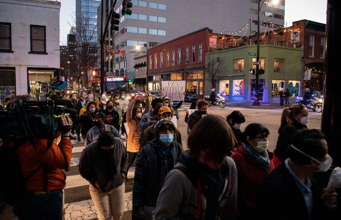 Demonstrators march through downtown Raleigh, N.C. on Thursday, Feb. 10, 2022 in support of the family of Daniel Turcios, who was shot and killed by Raleigh police in January after a car accident.