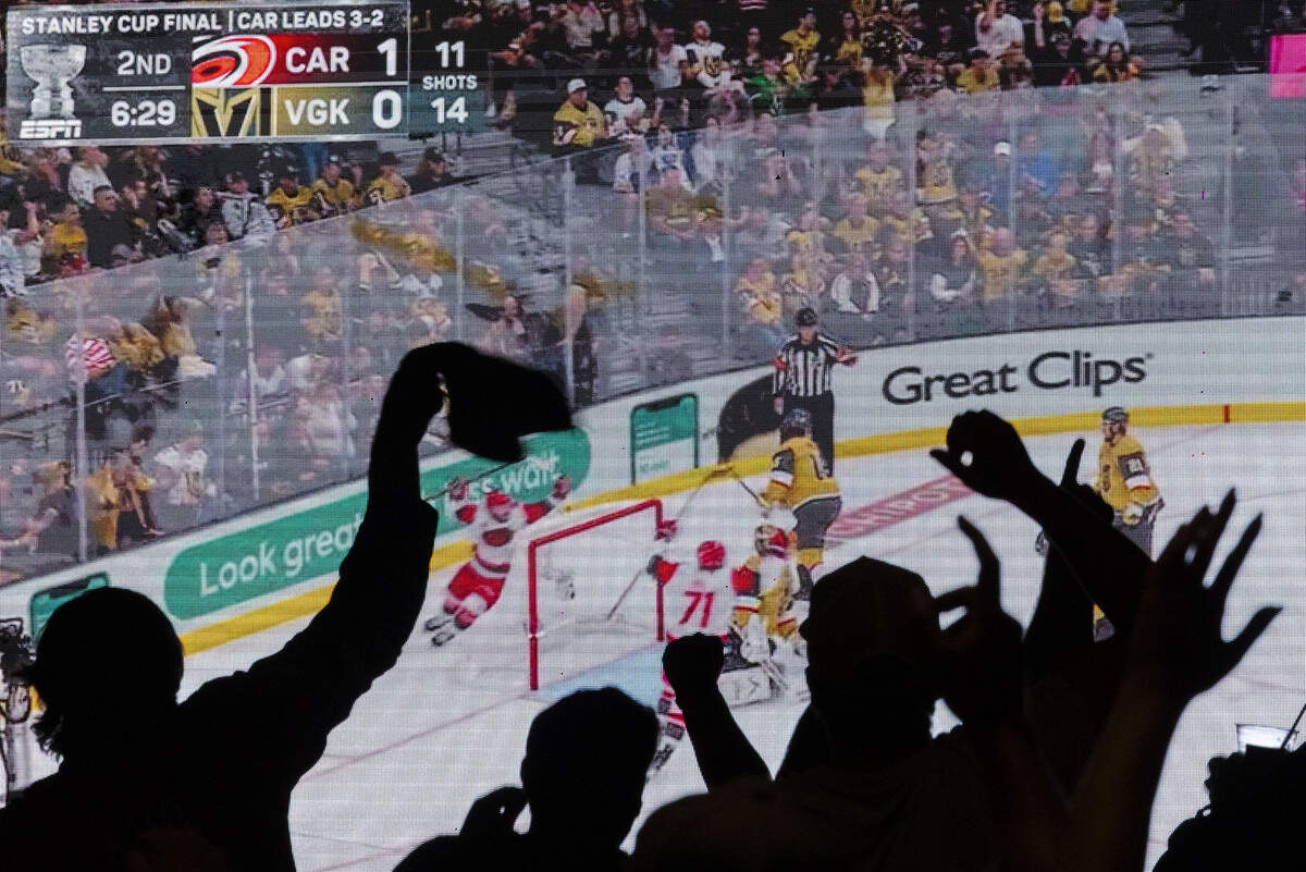 Fans cheered as the Carolina Hurricanes scored their second goal on the Vegas Golden Knights during a Stanley Cup finals game 6 watch party at Smoky Hollow on June 14, 2026, in Raleigh, North Carolina.