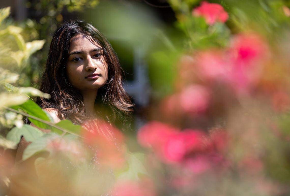 Fedora Castelino, 18, is photographed outside of St. Andrew the Apostle Catholic Church on Monday, June 6, 2022, in Apex, N.C. Castelino, whose parent is a H-1B visa holder, must receive a student or an H-1B visa to remain in the United States after she turns 21. She is studying neuroscience at the University of South Carolina.