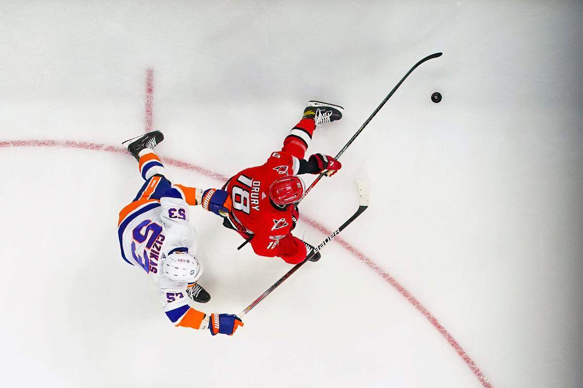 Carolina Hurricanes center Jack Drury (18) skates with the puck against New York Islanders center Casey Cizikas (53) during the first period in game two of the first round of the 2023 Stanley Cup Playoffs at PNC Arena.