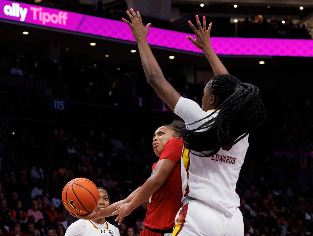 N.C. State’s Zamareya Jones drives around South Carolina’s Joyce Edwards during the second half of the Wolfpack’s 71-57 loss on Sunday, Nov. 10, 2024, at Spectrum Center in Charlotte, N.C.