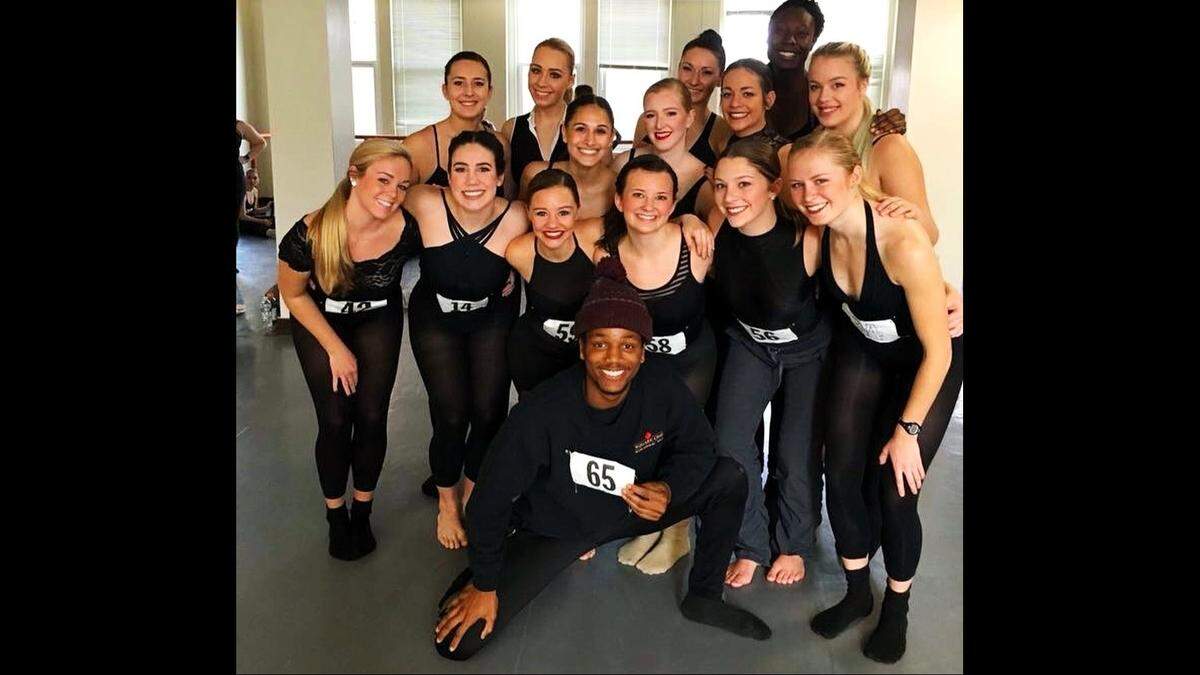 Benji Martin Jr. (center bottom) poses with members of his East Carolina University dance group. Martin, who graduated from ECU in 2019, is charged with murder in the Nov. , death of WakeMed Garner Healthplex police officer Roger Smith.