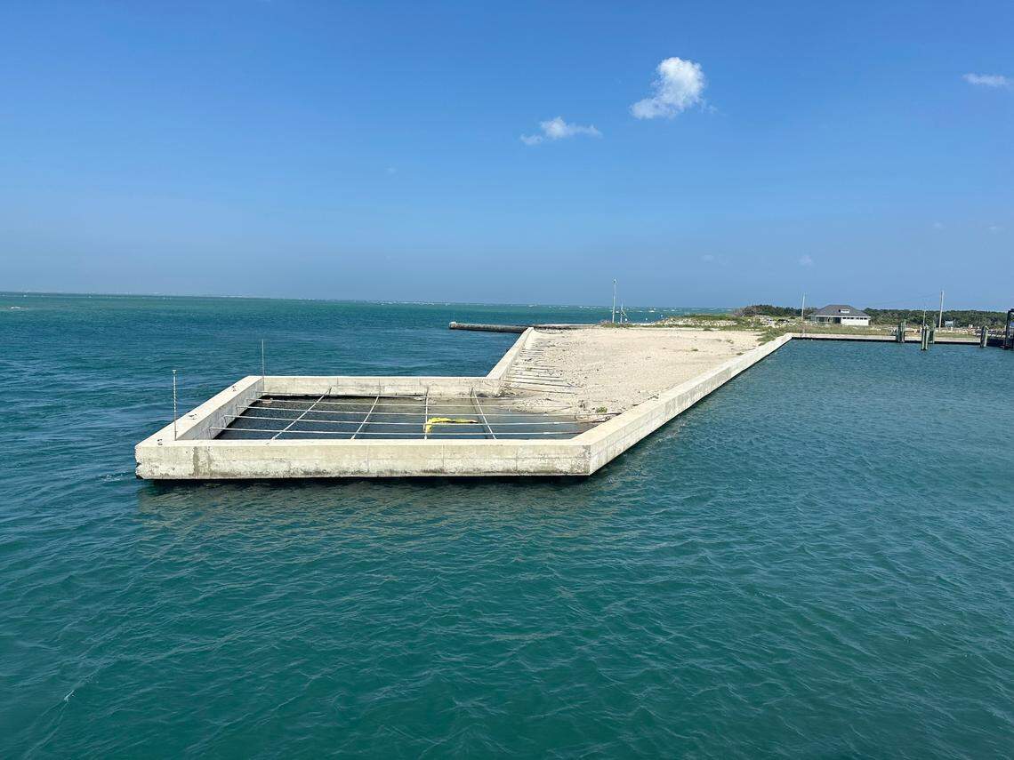 The state built this concrete bulkhead to protect the ferry docks at the north end of Ocracoke Island, but tides have already washed away some of the sand behind it. Photo taken May 21, 2025.