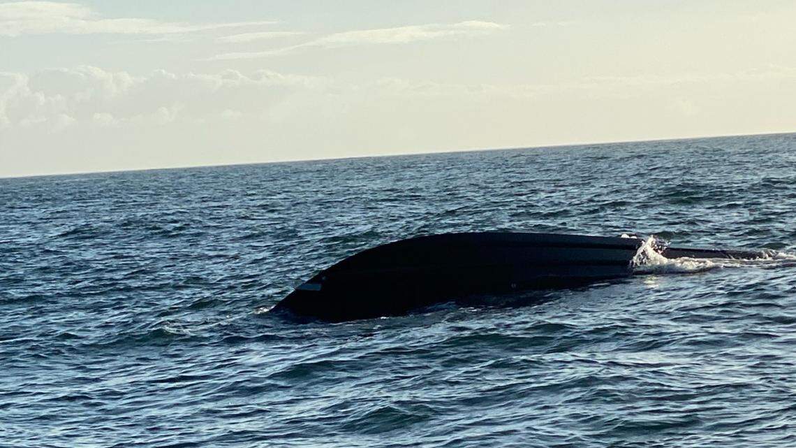 A 35-foot fishing vessel sits overturned near Beaufort Inlet, North Carolina, on Nov. 10, 2020.