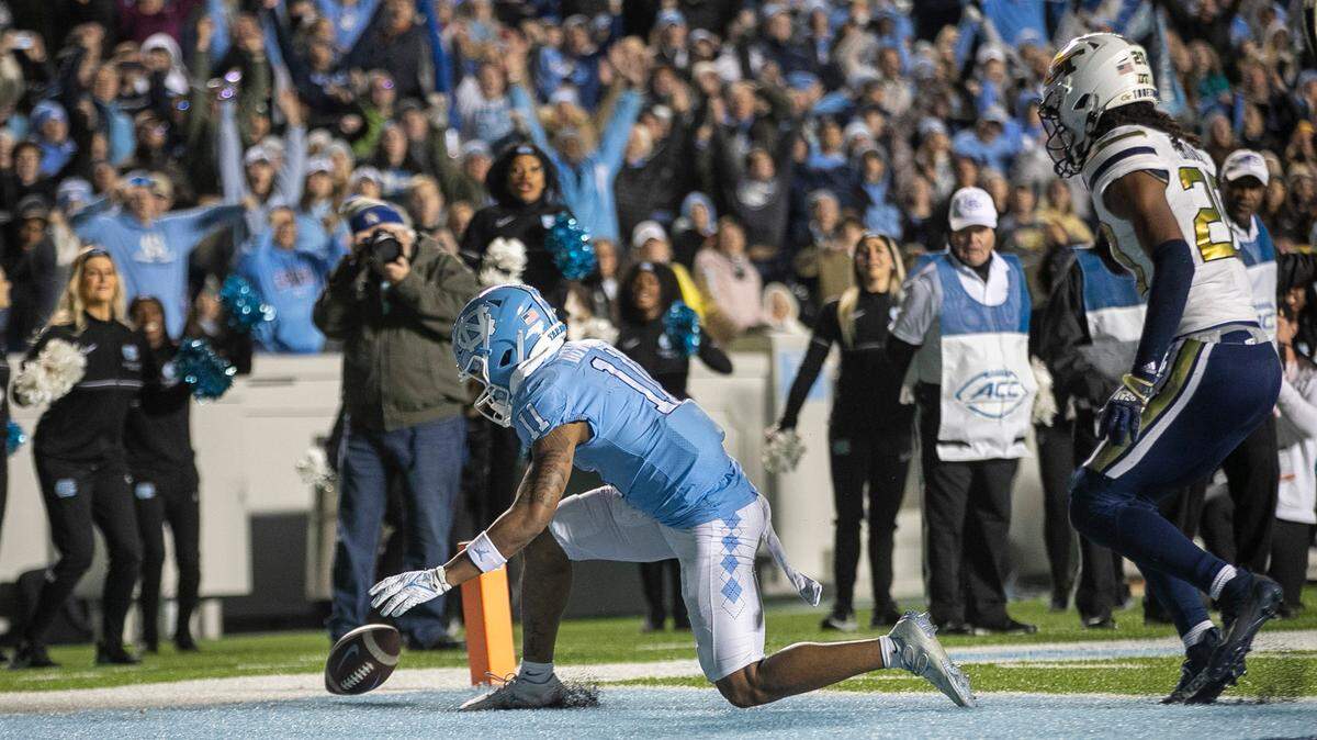 North Carolina’s Josh Downs (11) drops a pass from quarterback Drake Maye on fourth down with 4:10 to play in the fourth quarter on Saturday, November 19, 2022 at Kenan Stadium in Chapel Hill, N.C. The Tar Heels fell to the Yellowjackets 21-17.