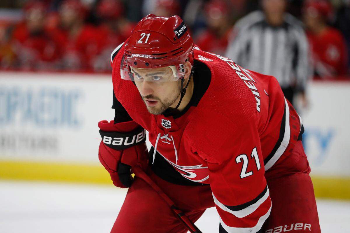 Carolina Hurricanes’ Nino Niederreiter (21) waits for a face-off against the Montreal Canadiens during the second period of an NHL hockey game in Raleigh, N.C., Thursday, Dec. 30, 2021. (AP Photo/Karl B DeBlaker)