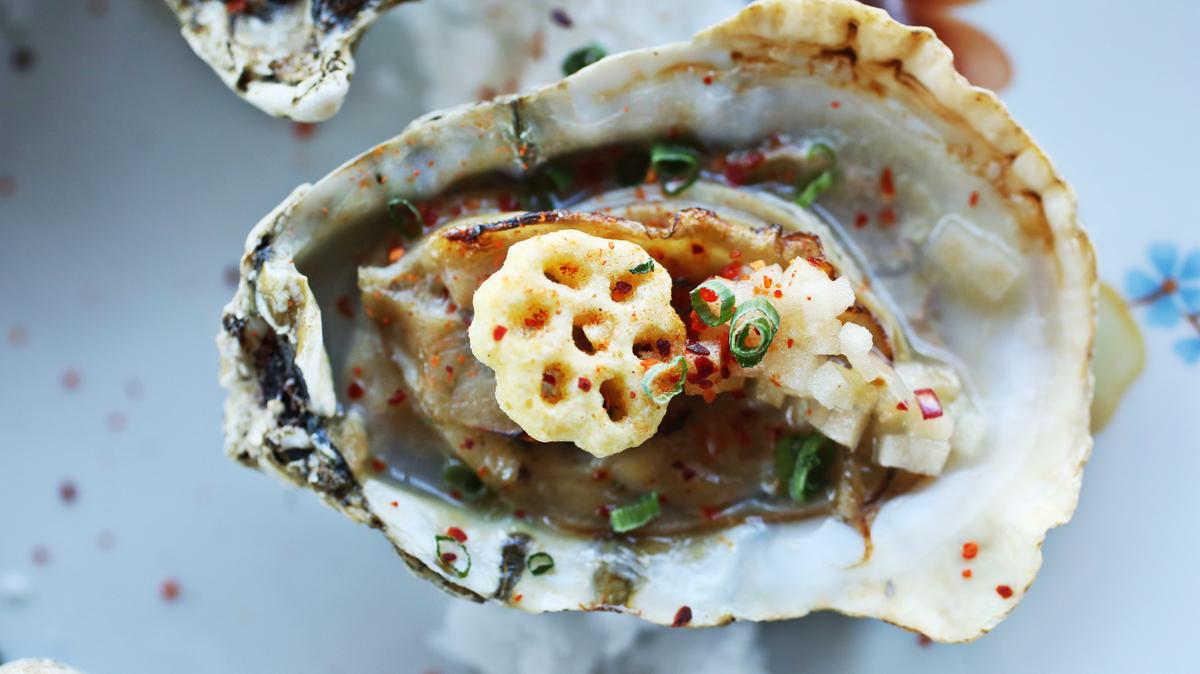 The Honeycomb Oysters are a half dozen oysters, gently warmed and finished with honey butter, apple mignonette, espelette pepper, and a garnishing crown of Honeycomb cereal.