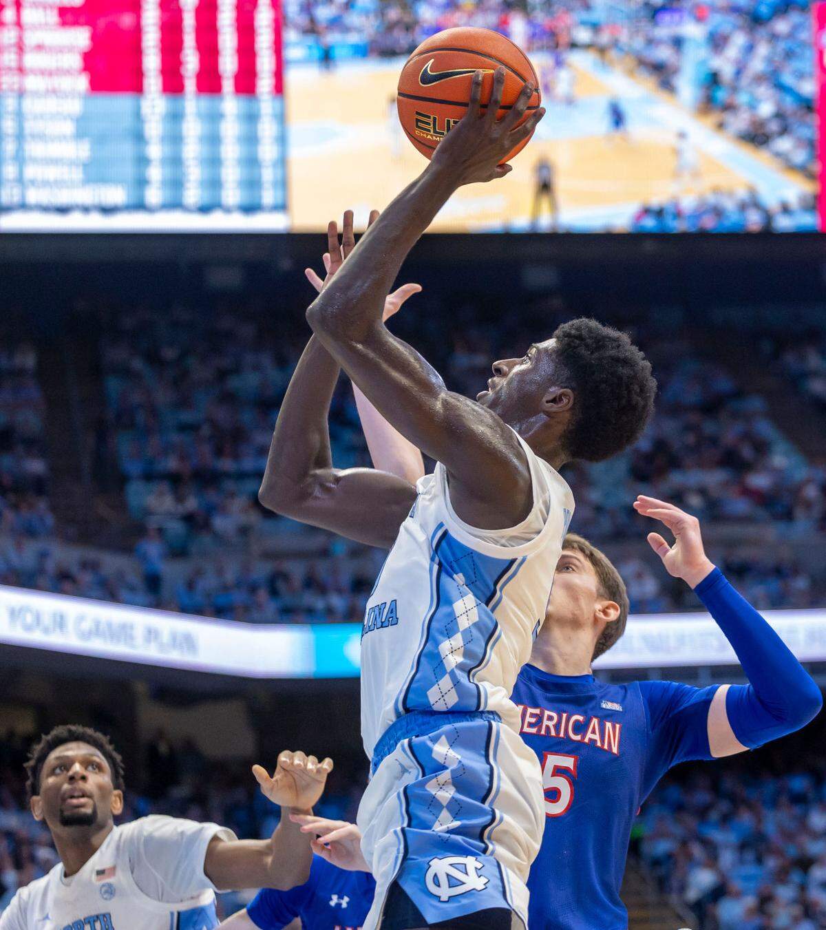 North Carolina forward Drake Powell (9) puts up a shot against American University forward Matt Rogers (15) during the first half on Friday, November 15, 2024 at the Smith Center in Chapel Hill, N.C.
