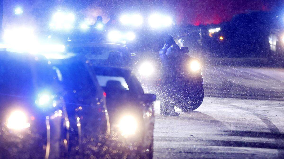 Officers stand on Chapanoke Road after responding to a shooting in the 600 block of Democracy Street in Raleigh on Jan. 21, 2025. The N.C. Senate passed a bill that would give bonuses to state and local law enforcement on Monday, Sept. 22, 2025.