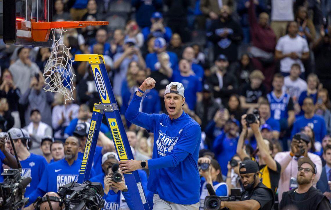 Duke coach Jon Scheyer reacts as he climbs the ladder to cut down the net following the Blue Devils’ 85-65 victory over Alabama on Saturday, March 29, 2025 during the NCAA East Regional final at Prudential Center in Newark, N.J.