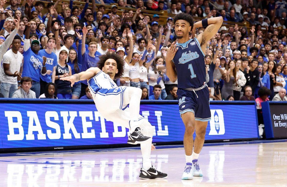 Duke’s Tyrese Proctor (5) watches his three-pointer go in after being fouled by Maine’s Kellen Tynes (1) during the second half of Duke’s 96-62 victory over Maine at Cameron Indoor Stadium in Durham, N.C., Monday, Nov. 4, 2024.