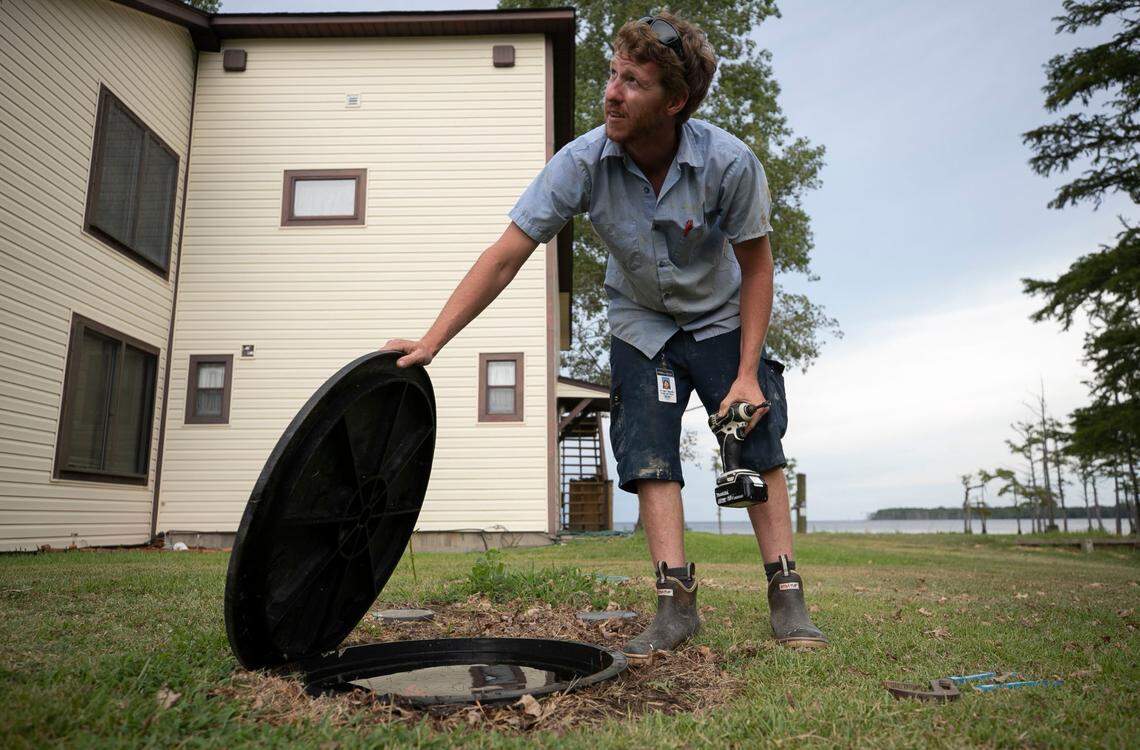 Jordan Sexton a Tyrrell County Water/Sewer Department employee works to find the cause of a water leak at a home on Folly Landing Road on Thursday, July 23, 2020.