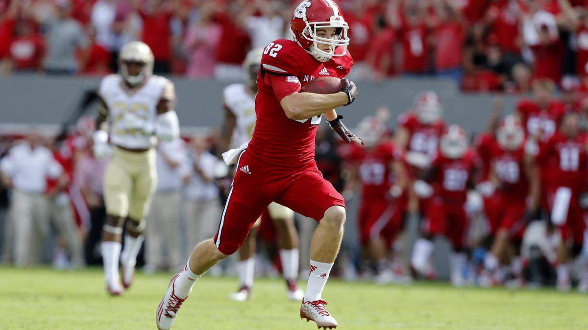 N.C. State wide receiver Bo Hines (82) pulls in a 54-yard touchdown reception during the first half of the Wolfpack’s game against Florida State at Carter-Finley Stadium in Raleigh, N.C., Saturday, September 27, 2014.