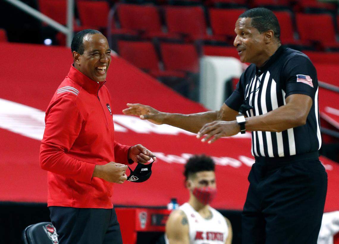 N.C. State head coach Kevin Keatts laughs at a call by official Ted Valentine during the first half of N.C. State’s game against UNC at PNC Arena in Raleigh, N.C., Tuesday, December 22, 2020.