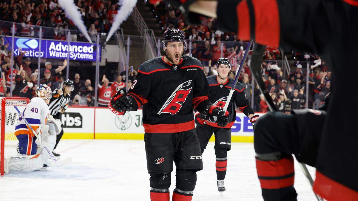 Carolina right wing Stefan Noesen (23) celebrates after Evgeny Kuznetsov scored during the first period of the Hurricanes game against the Islanders in the first round of the Stanley Cup playoffs at PNC Arena in Raleigh, N.C., Saturday, April 20, 2024.