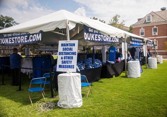 Duke University Stores set up their merchandise outside under a tent for students and their parents to browse before and after moving into dorms on campus at Duke University, on Friday, Aug. 7, 2020, in Durham, N.C.
