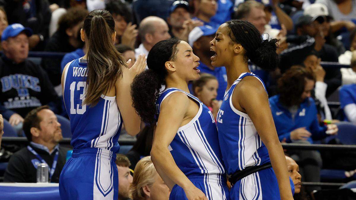 Duke’s Taina Mair and Ashlon Jackson react on the bench during the second half of the Blue Devils’ 61-56 ACC Tournament semifinal win over Notre Dame on Saturday, March 8, 2025, at First Horizon Coliseum in Greensboro, N.C.