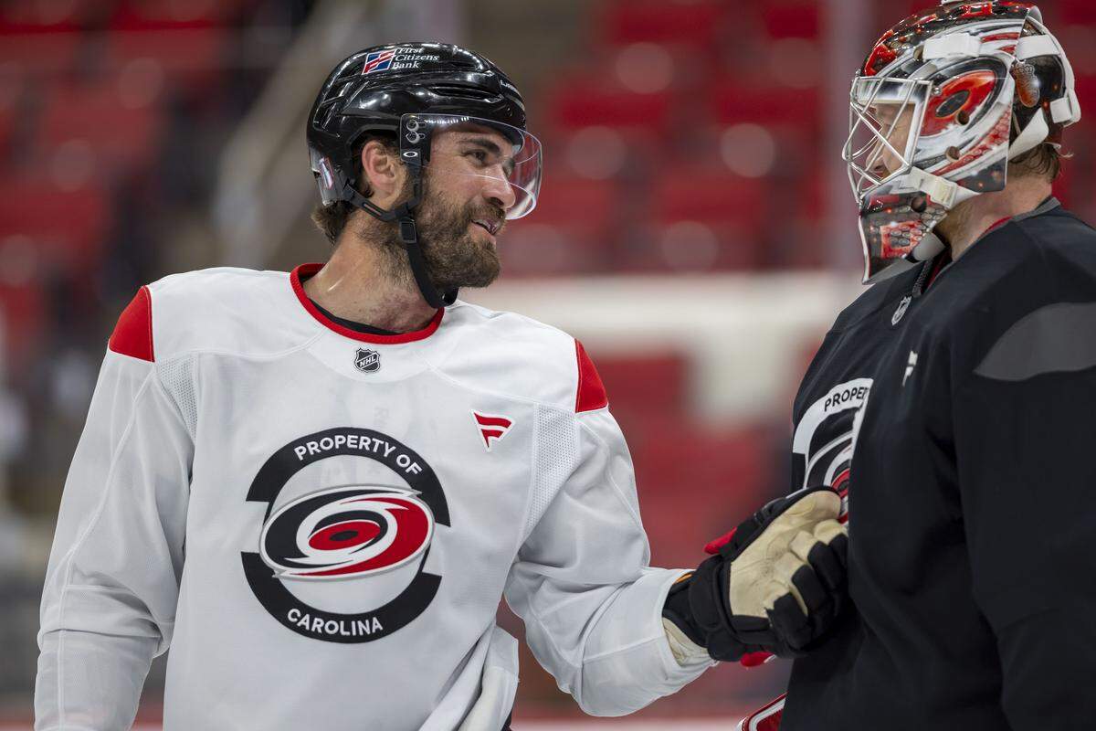Carolina Hurricanes left wing William Carrier (28) talks with  goalie Frederik Andersen during practice on Friday, May 15, 2026 at Lenovo Center in Raleigh, N.C.