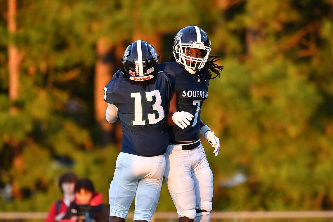 Southeast Raleigh's Tyrus Whyte (7) celebrates his touchdown against Cardinal Gibbons with Kendrick Wright (13) during the first half. The Southeast Raleigh Bulldogs and the Cardinal Gibbons Crusaders met in a non-conference football game in Raleigh, N.C. September 12, 2025