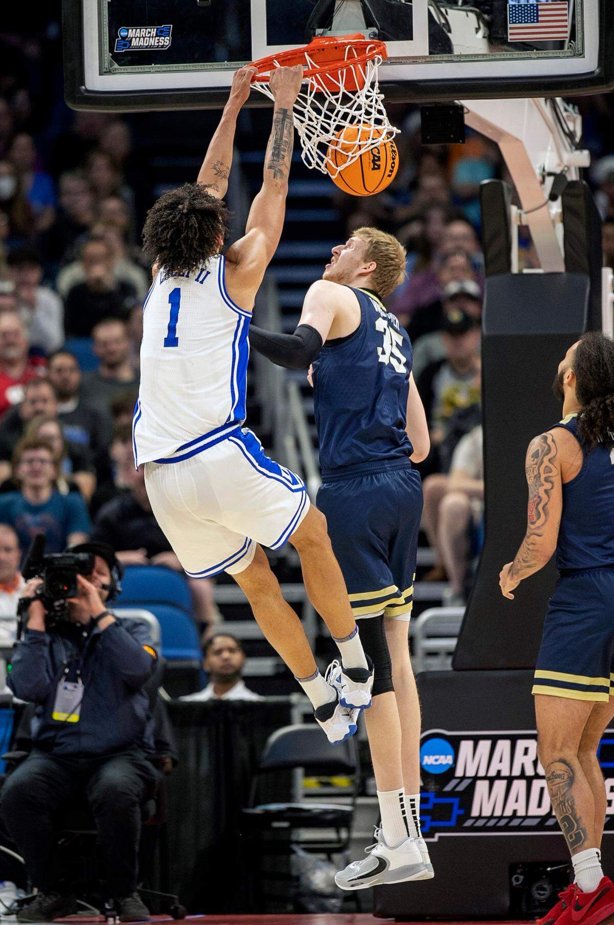 Duke’s Dereck Lively II (1) dunks over Oral Roberts’ Connor Vanover (35) in the first half during the first round of the NCAA Tournament on Thursday, March 16, 2023 at the Amway Center in Orlando, Fla.