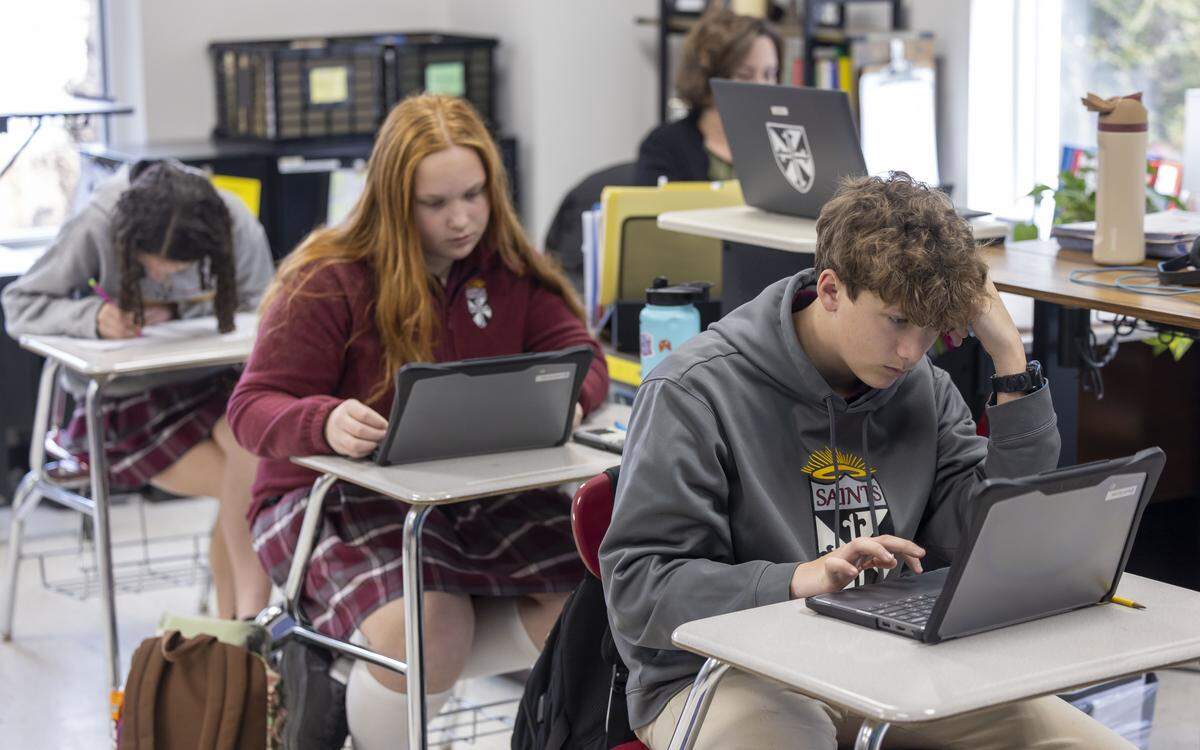 Kai Ingham, an eighth grader St. Catherine of Siena Catholic School, works in his social studies and religion class on Thursday, February 12, 2026 in Wake Forest, N.C.