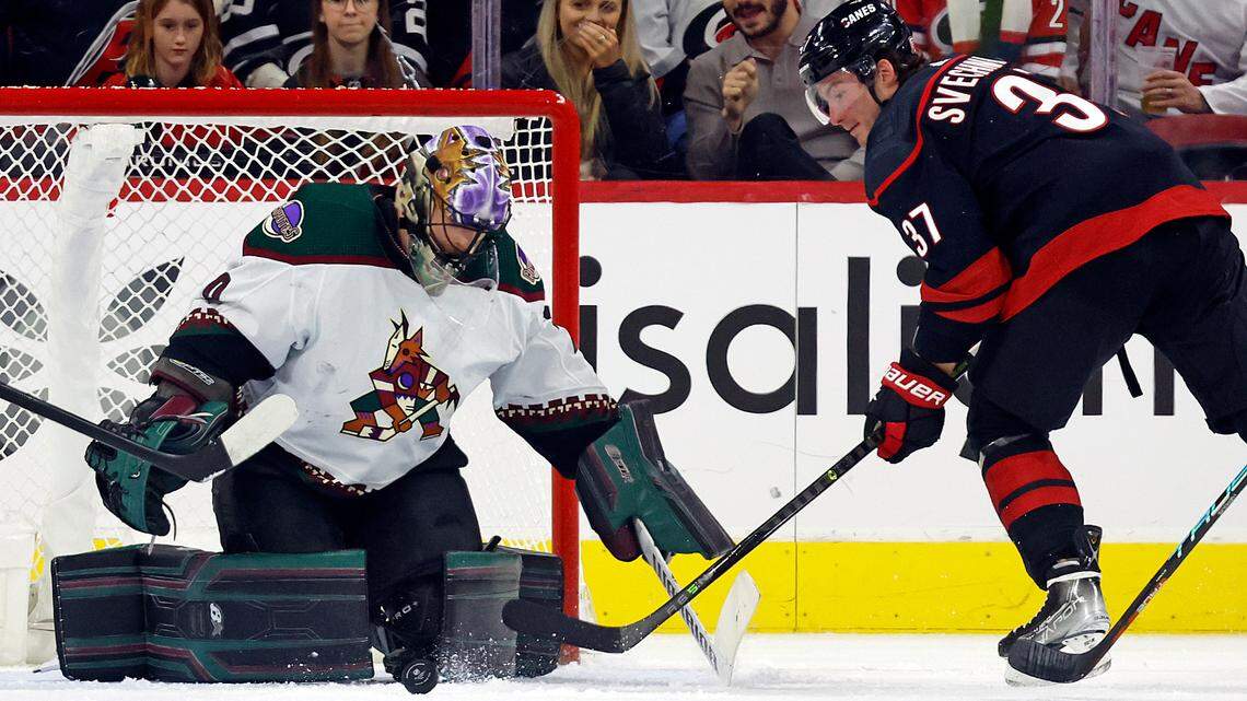 Arizona Coyotes goaltender Karel Vejmelka (70) stops the shot of Carolina Hurricanes forward Andrei Svechnikov (37) during the first period of an NHL hockey game in Raleigh, N.C., Wednesday, Nov. 23, 2022.