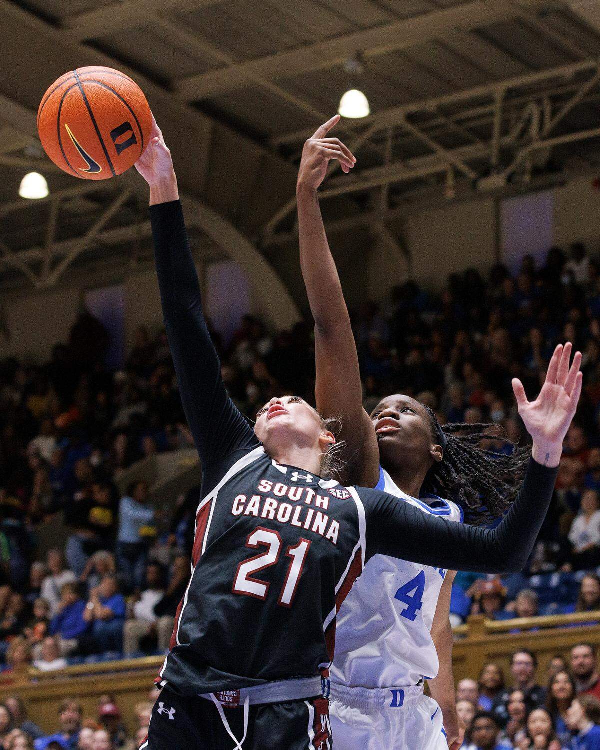 South Carolina’s Chloe Kitts pulls down a rebound away from Duke’s Jadyn Donovan during the first half of the Blue Devils’ 77-61 loss on Sunday, Dec. 3, 2023, at Cameron Indoor Stadium in Durham, N.C.