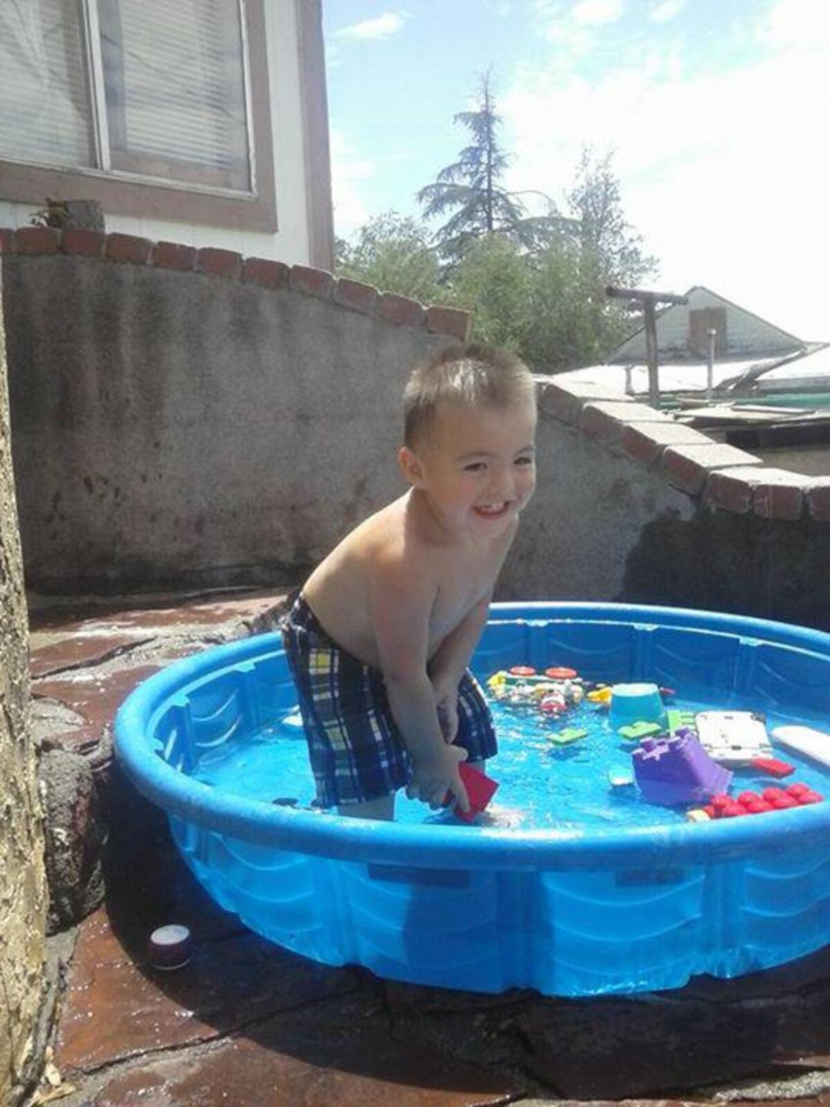 Michael Rivera plays in a swimming pool in Arizona prior to being adopted by the Rivera family in 2017. Michael died later that year in North Carolina from injuries related to blunt force trauma, an autopsy shows.